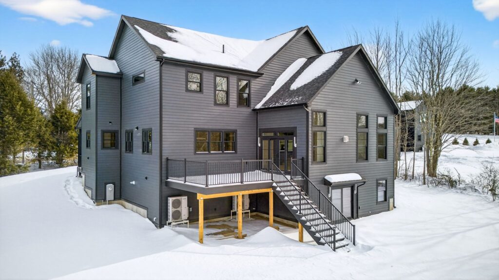 Snowy rear exterior of the Meadow House in Falmouth, Maine