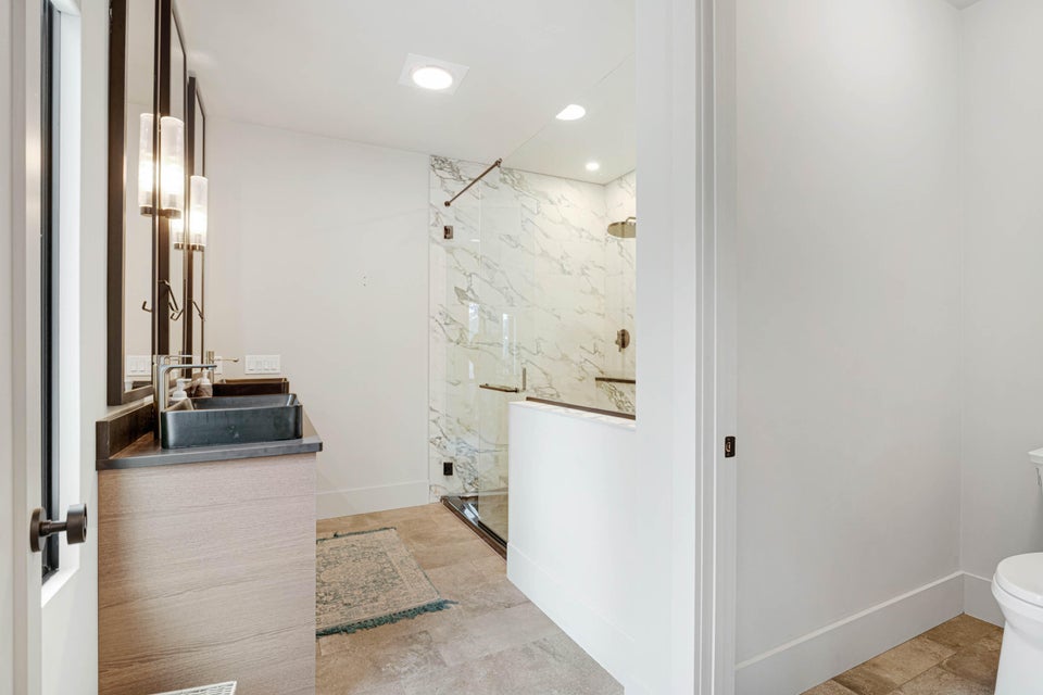 Upstairs Primary Bath with wet room at the Mountain House in Carrabassett Valley, Maine